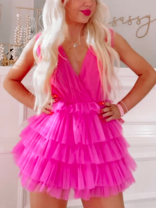 Hot pink tulle romper with layered ruffle skirt.
