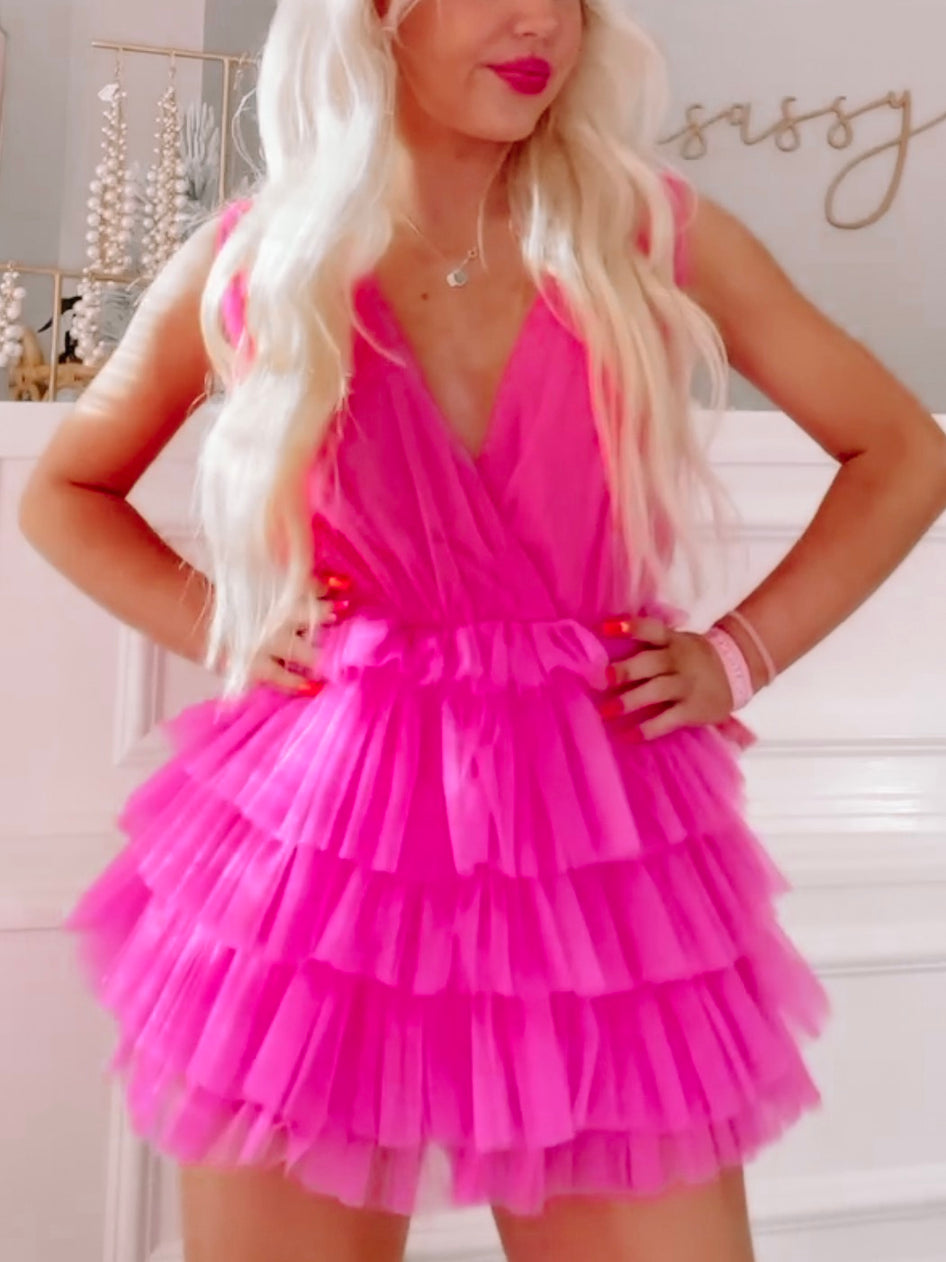 Hot pink tulle romper with tiered ruffle skirt; perfect for parties.
