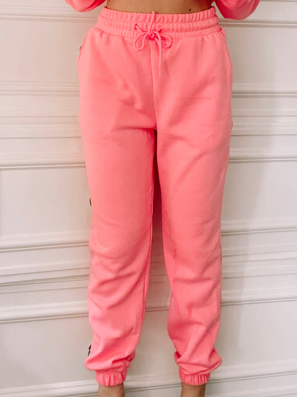 Bright + Toasty pink joggers; comfy fleece sweatpants with drawstring waist.
