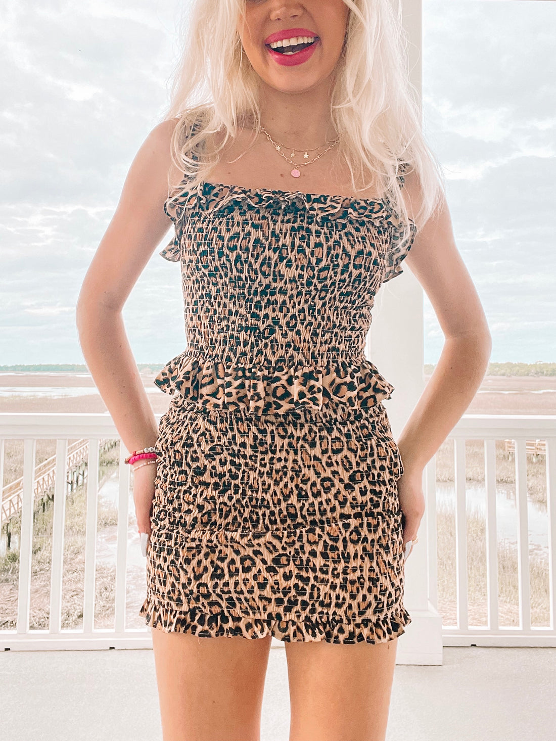 Feline Fine Top: Brown leopard print smocked crop top and mini skirt set with ruffle trim.
