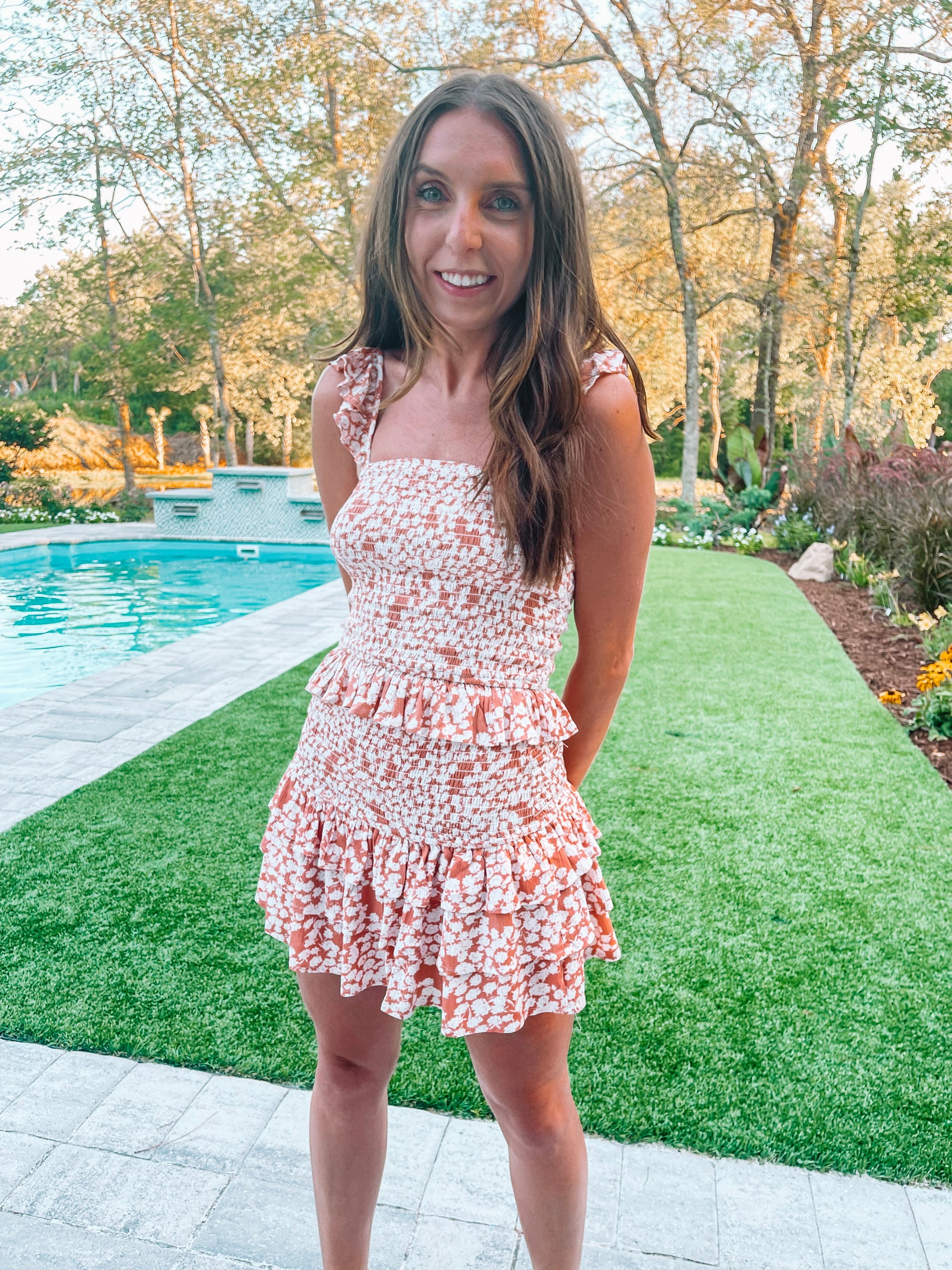 Calla Floral Set | Brick: Peach floral smocked mini dress with ruffle details, perfect for summer.
