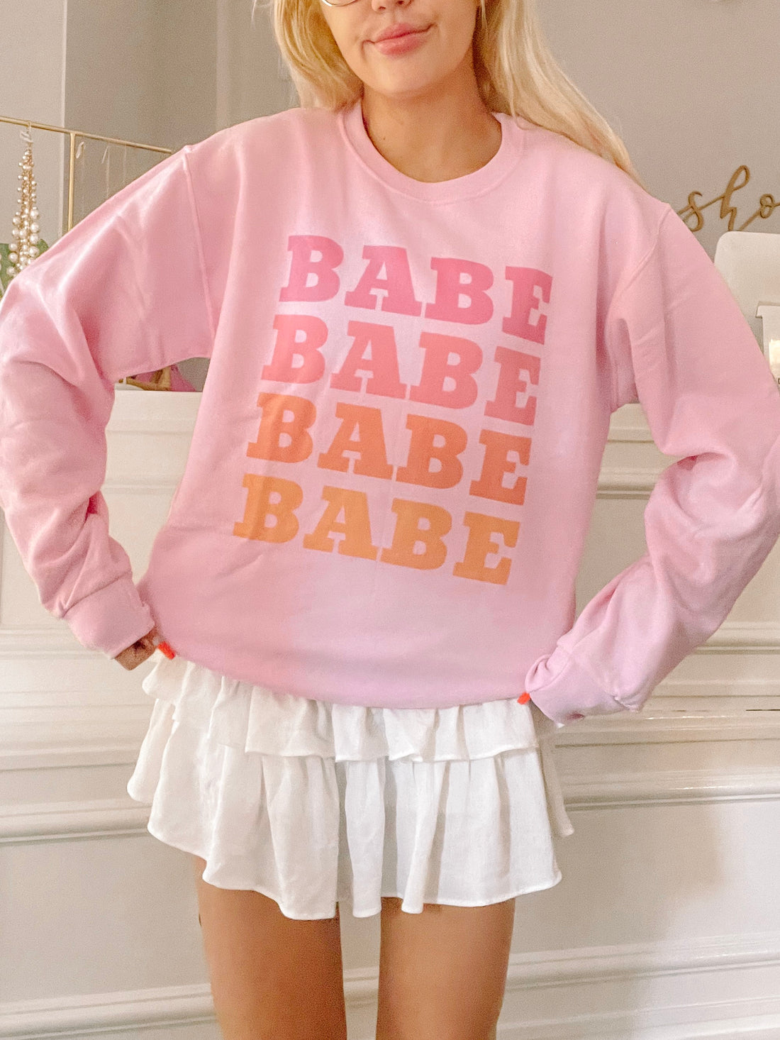 Pink Babe sweatshirt with ombre "Babe" graphic.
