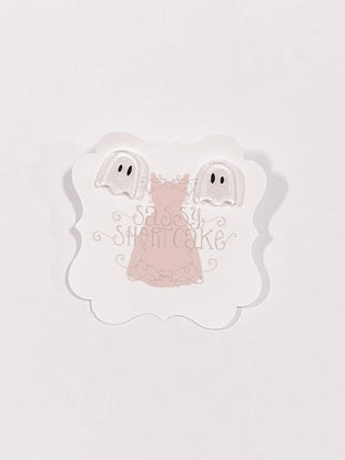 Adorable ghost-shaped Halloween earrings displayed on a pink card.
