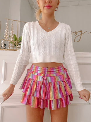Flirtatious Shimmer Skirt in pink rainbow; layered ruffle mini skirt with metallic shimmer.
