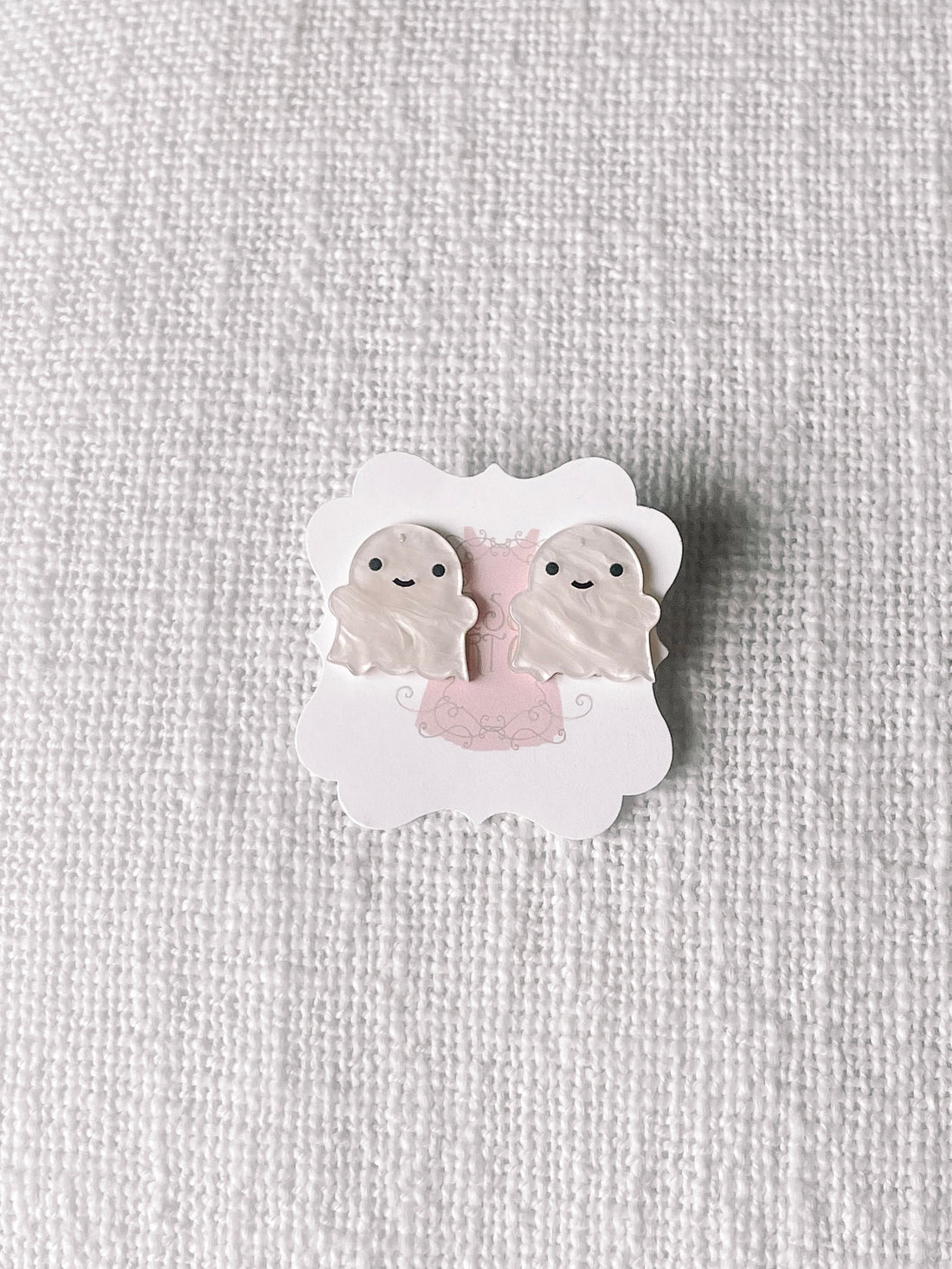 Adorable ghost-shaped Halloween earrings displayed on a card
