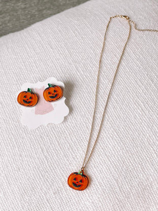 Pumpkin necklace and earrings set: gold chain necklace & orange pumpkin stud earrings for Halloween.
