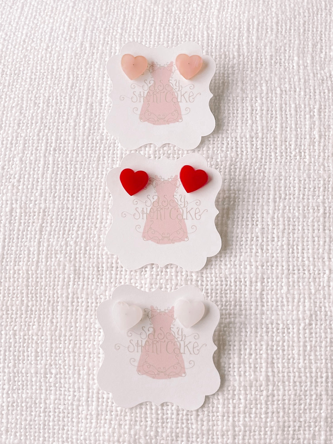 Sassy Shortcake Sweet Heart earrings: pink, red, and white heart-shaped studs.

