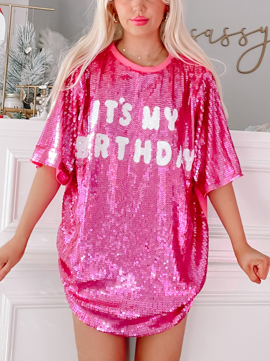Pink sequined birthday dress with "It's My Birthday" lettering.

