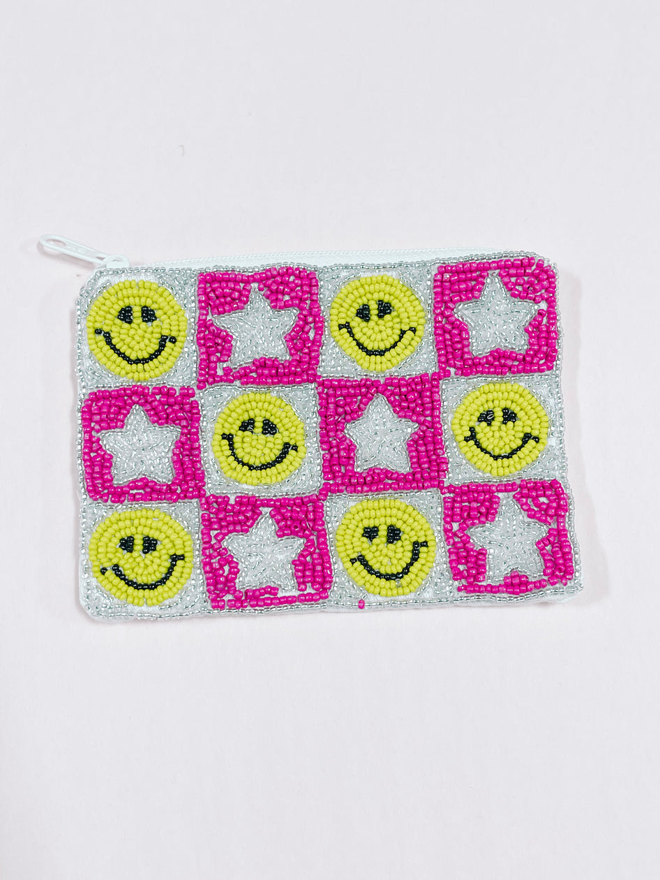 Beaded zipper pouch with pink and silver stars and smiley faces.
