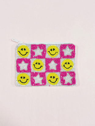 Beaded zipper pouch with smiley faces and stars; pink and silver beaded design.
