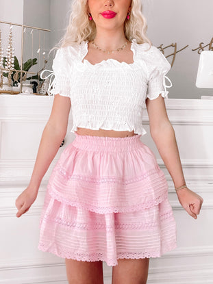 Dream Chaser tiered pink mini skirt with delicate lace trim
