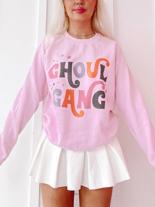 Pink Ghoul Gang crewneck sweatshirt with retro-style lettering and star details.
