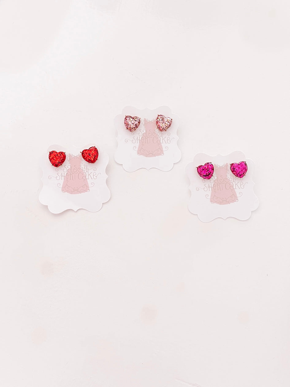 Sassy Shortcake Full of Love glitter heart earrings; red, pink & rose gold.
