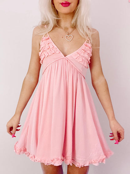Pink Strappy Sundays dress with ruffled neckline and hem.
