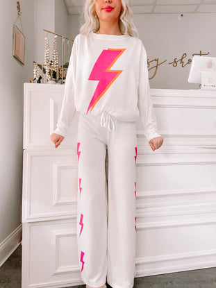 White Strike All Night PJ set with pink lightning bolt print.
