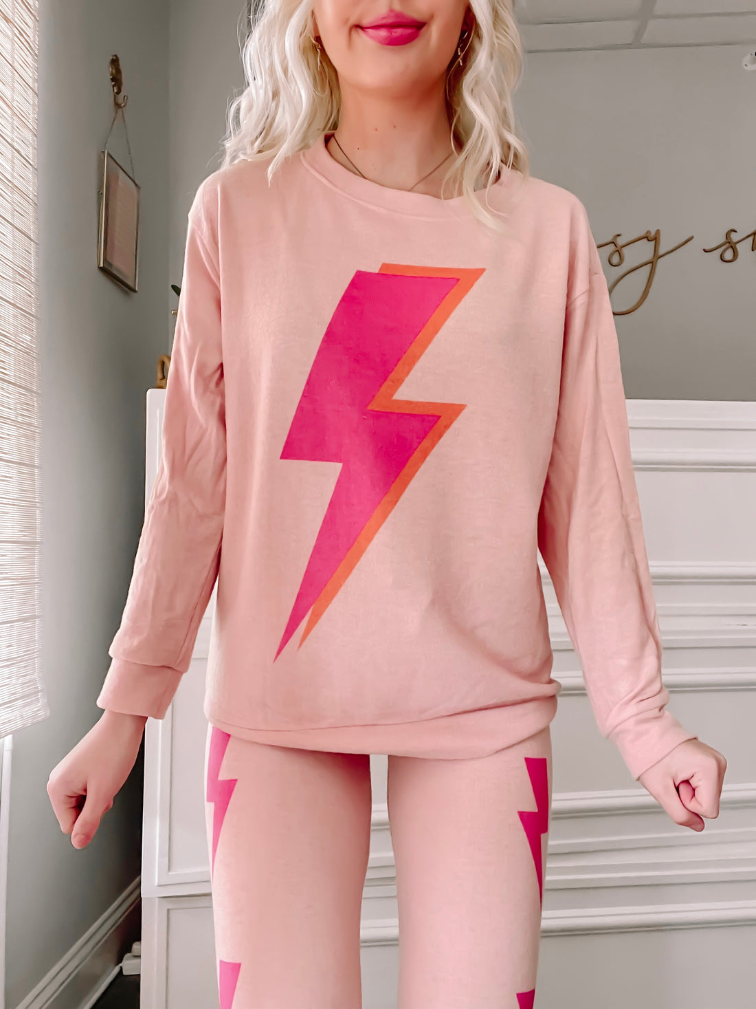 Pink Strike All Night PJ set featuring a bold lightning bolt graphic.
