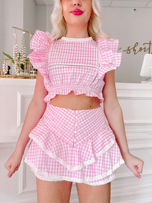Pink gingham ruffle crop top and skirt set; perfect summer outfit.
