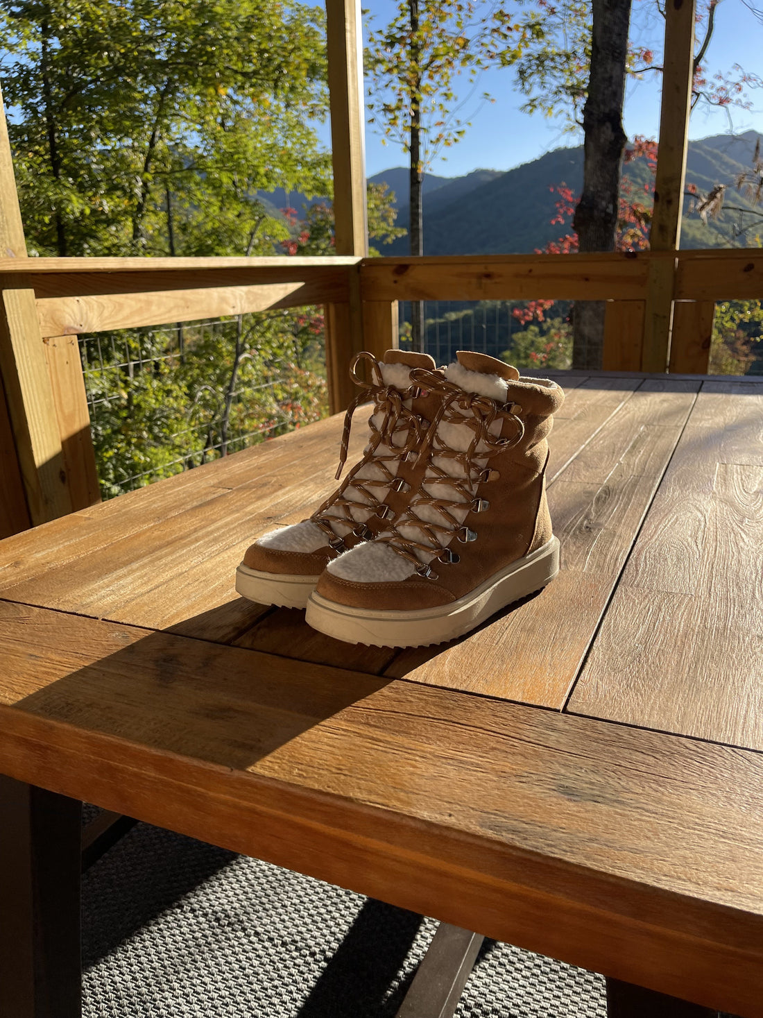 Tan suede Summit Boots with sherpa lining, perfect for fall hikes.
