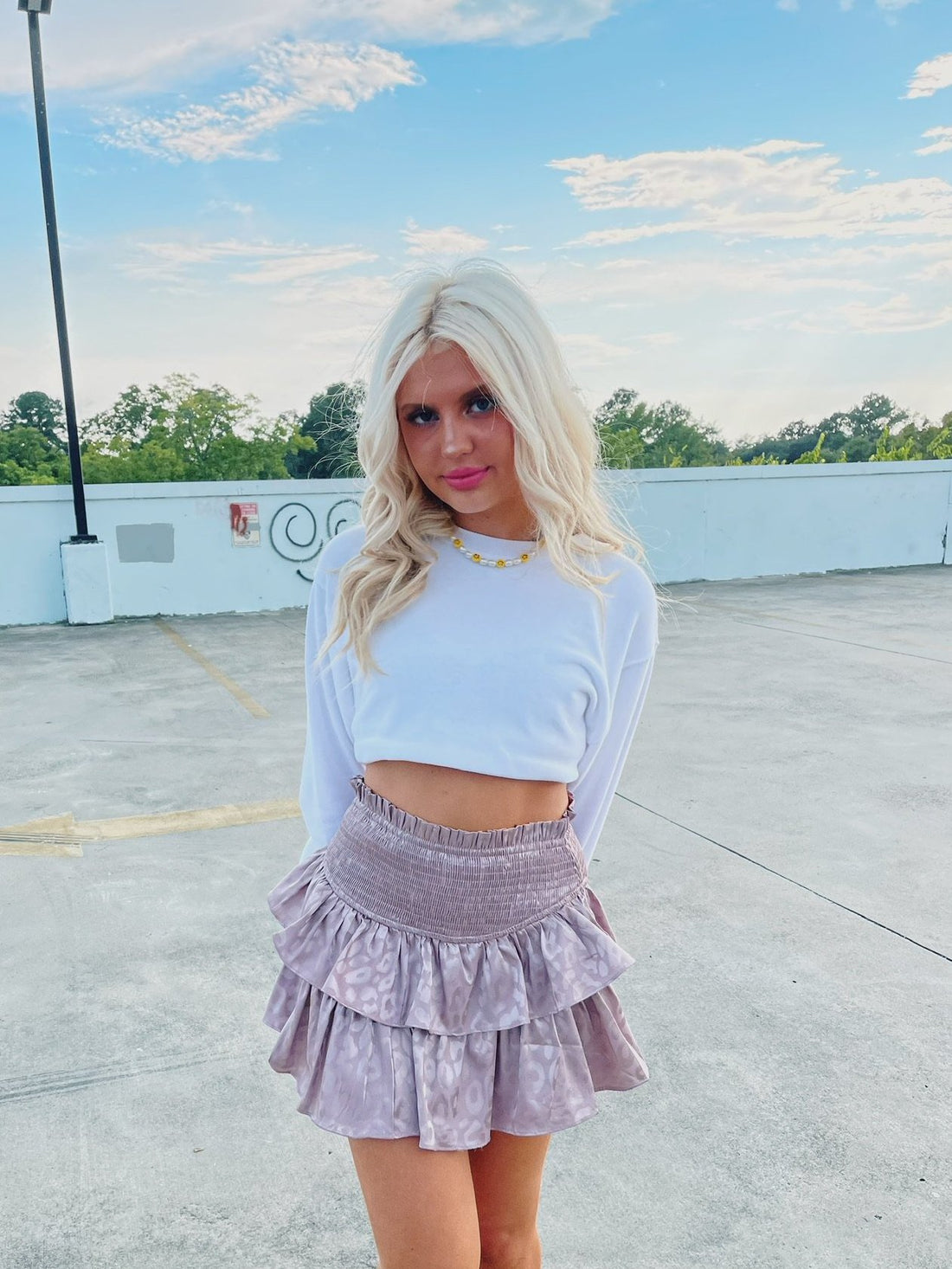 Mauve Roars N' Ruffles ruffle mini skirt with subtle leopard print.
