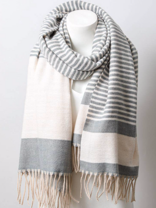 Soft Charcoal Stripe Scarf:  Gray and cream striped knit scarf with fringe, perfect for adding warmth and style.
