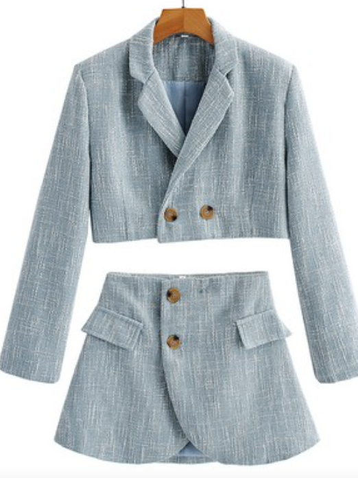Light blue cropped blazer and mini skirt set, textured fabric.
