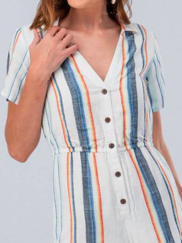 White linen romper with colorful vertical stripes, short sleeves, and button front.
