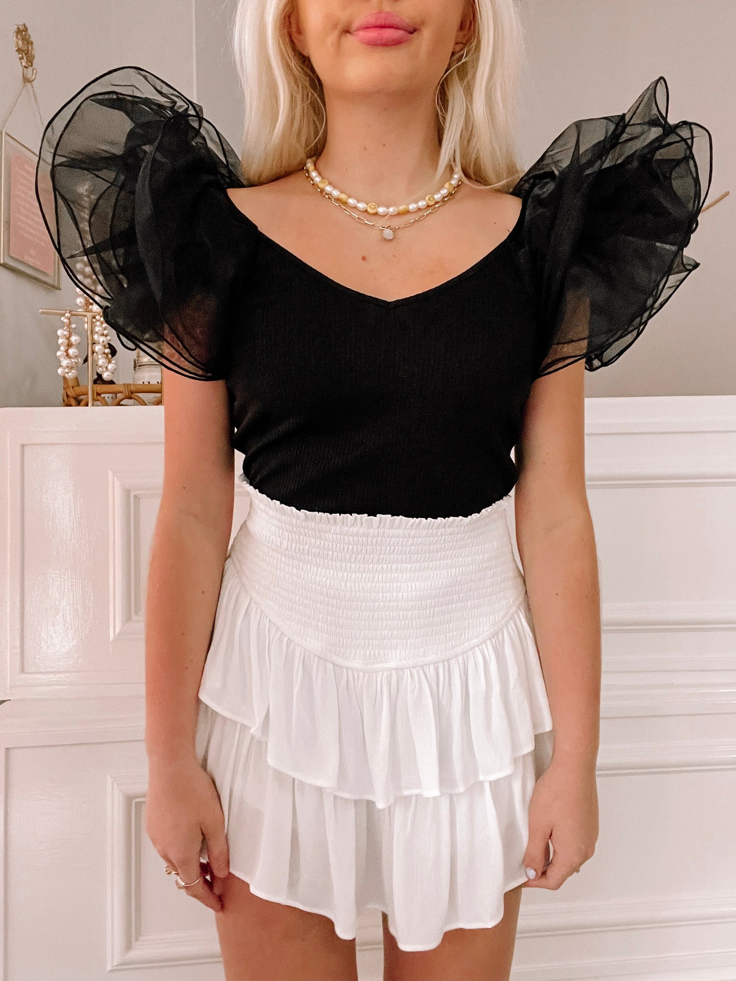 Black Swan Top:  Black ribbed v-neck top with sheer black organza puff sleeves.
