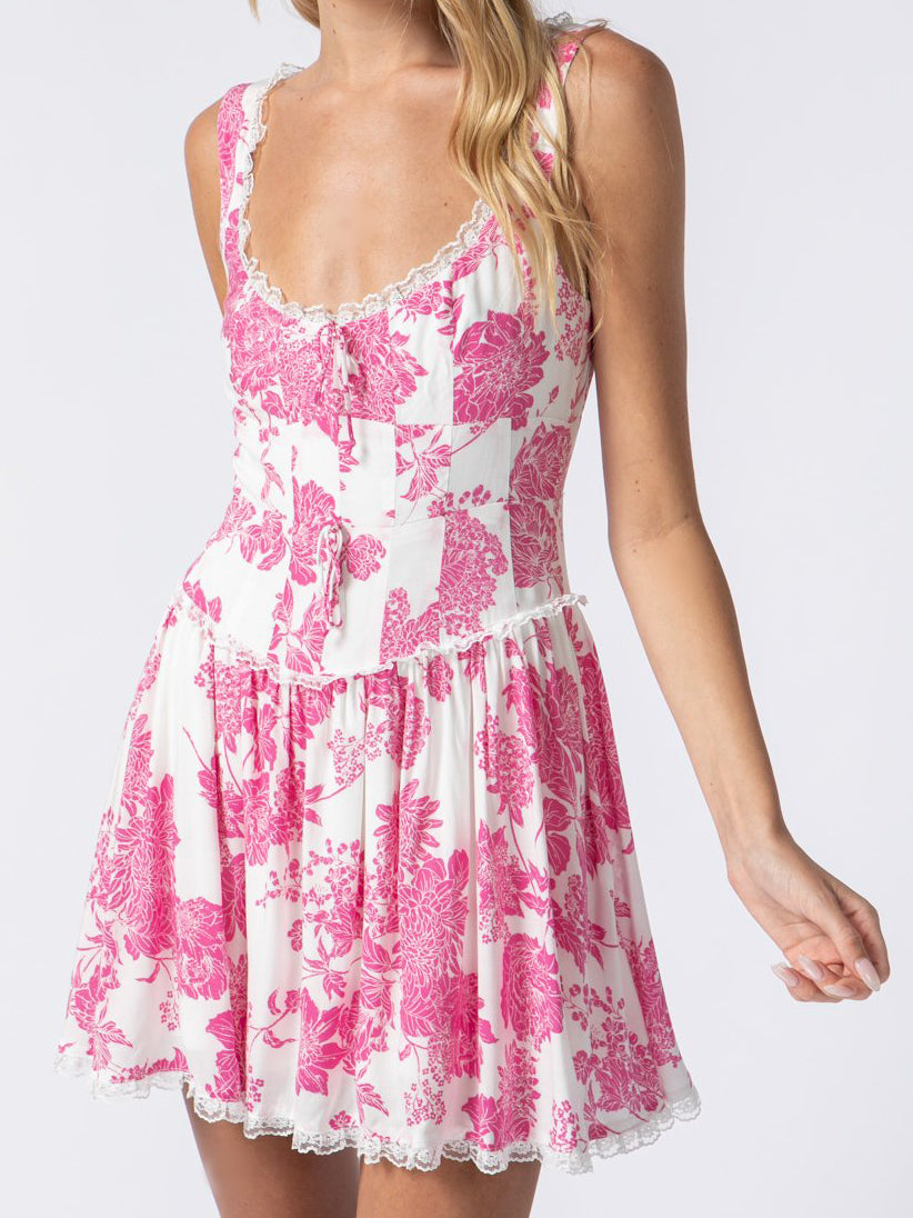 Pink floral mini dress with lace trim and corset bodice.
