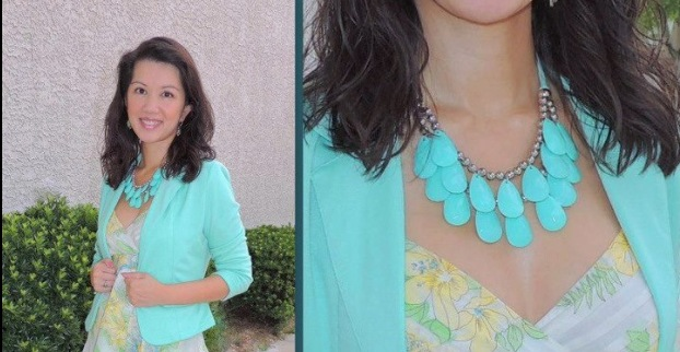 Aqua teardrop statement necklace paired with a mint green blazer and floral dress.
