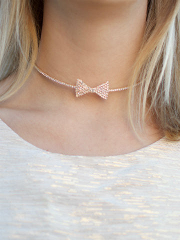 Rose gold bow choker necklace with sparkling crystal accents
