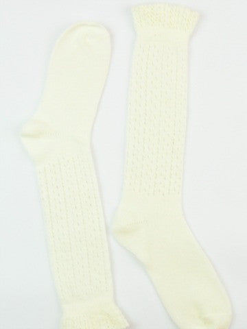 Cream-colored knee-high socks with delicate ruffle trim and an openwork pattern.
