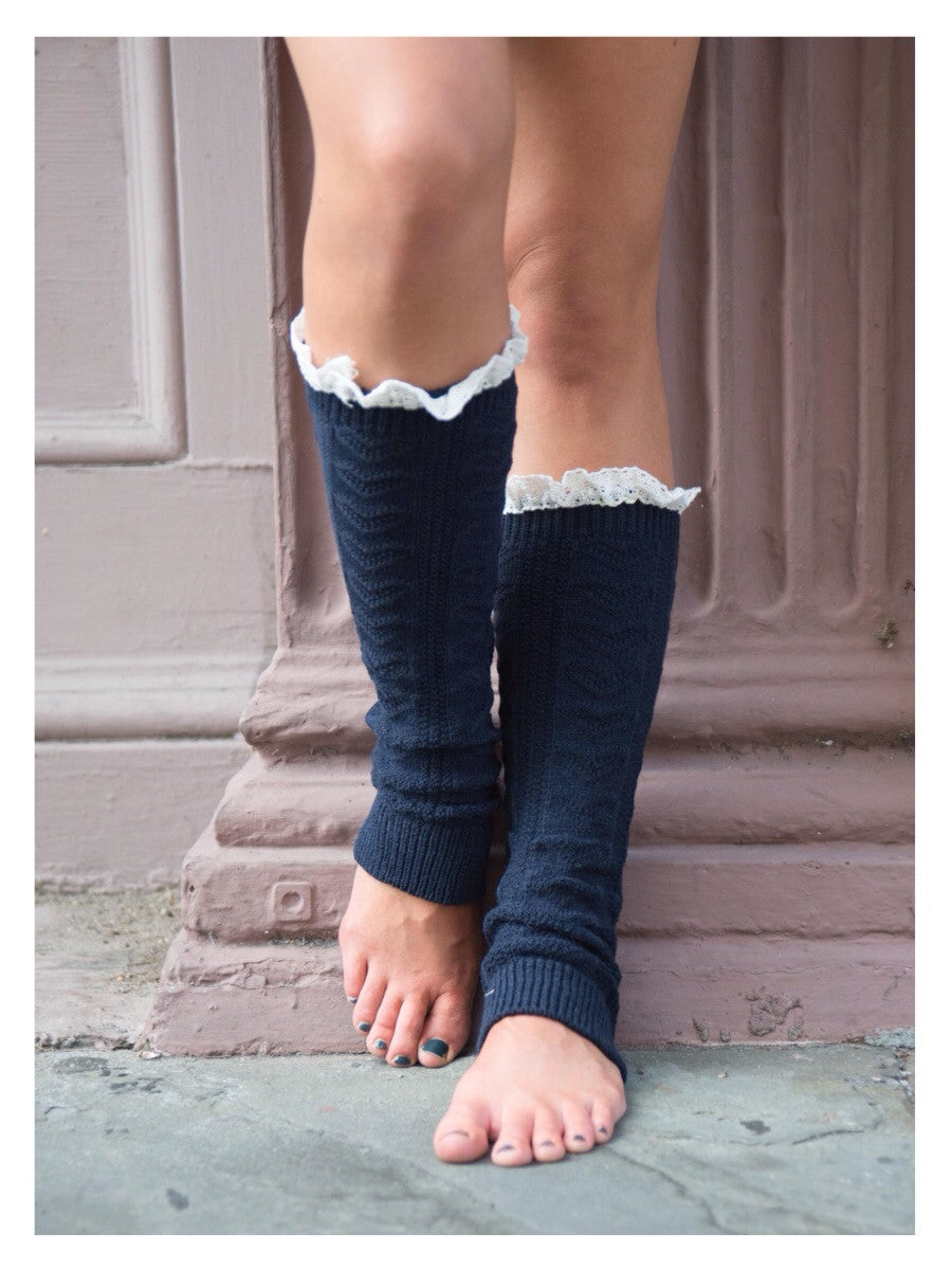 Navy blue knitted leg warmers with delicate lace trim
