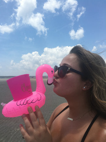 Pink Flamingo inflatable drink holder for beach fun.
