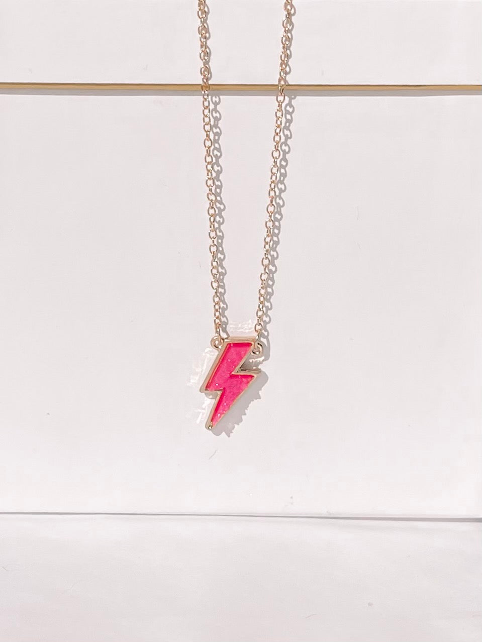 Pink Lightning Bolt necklace with gold chain
