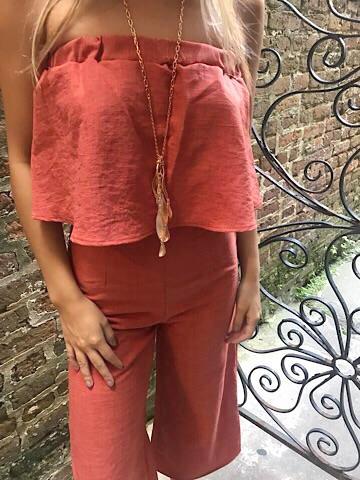 Rust-colored linen Hearts a Flutter cropped jumpsuit with wide legs.
