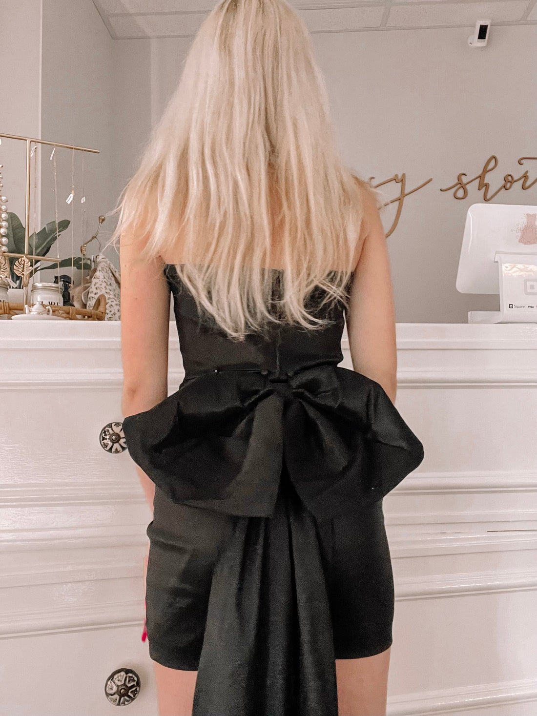 Black Showtime dress with large back bow detail
