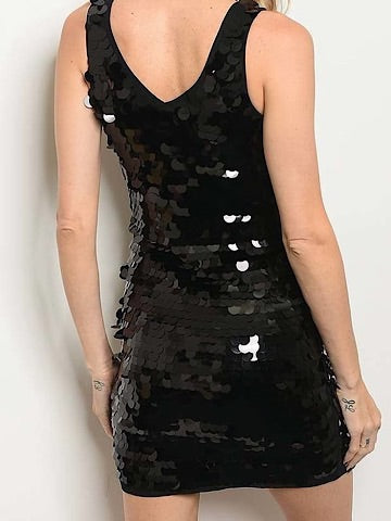 Black sequin mini dress, sleeveless, v-neck, shown on model from back.
