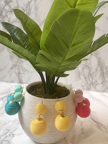 Twice As Nice double-ball earrings in yellow, pink, and teal; summery statement jewelry.

