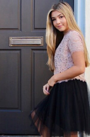 Blush lace top and black tulle skirt outfit.
