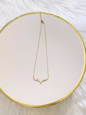 Gold Sassy Antler necklace with delicate clear accents.

