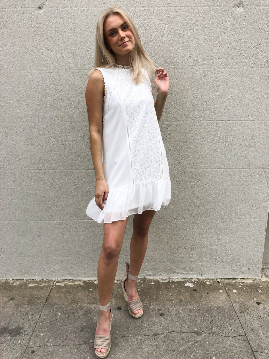White lace detail shift dress, ruffle hem, perfect for summer.
