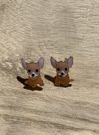 Cute brown Chihuahua dog stud earrings on light wood background
