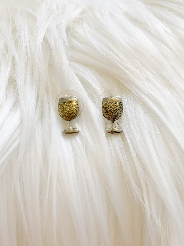 Gold glitter wine glass earrings; stylish and fun.
