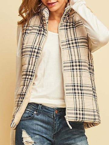 Cream quilted vest with a subtle plaid pattern, shown on a model.
