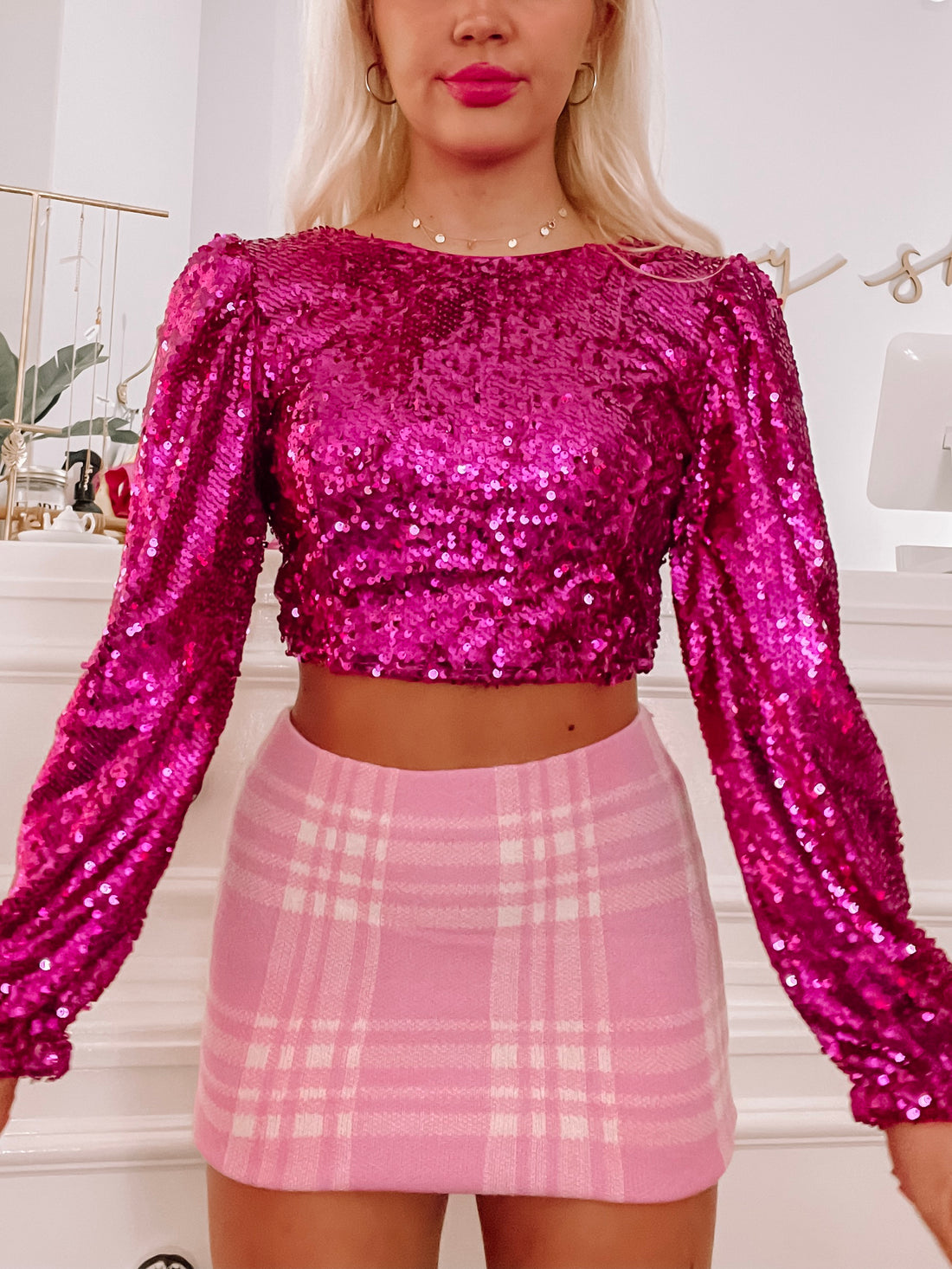 Fuchsia sequin Eliana top with long sleeves, perfect for parties.
