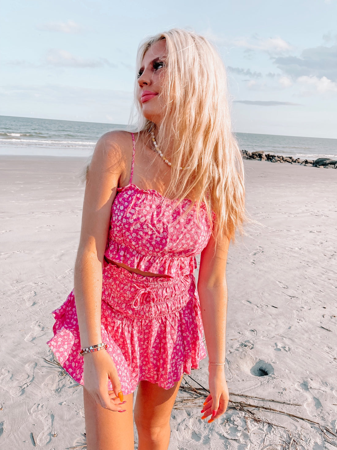 Pink floral ruffle top and shorts set, perfect for summer.
