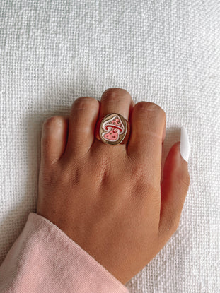 Gold So Mush Love ring featuring a pink mushroom design.
