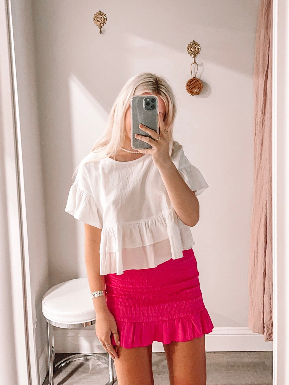 Hot pink Malibu Barbie smocked mini skirt with ruffle hem.
