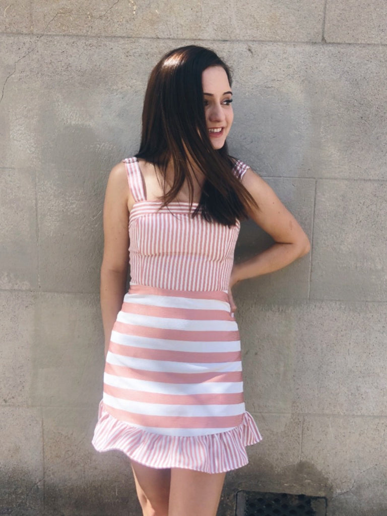 Pink and white striped Truly Yours dress with ruffled hem
