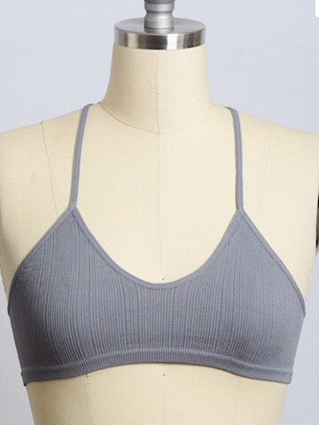 Gray ribbed bralette with crisscross straps, displayed on a dress form.
